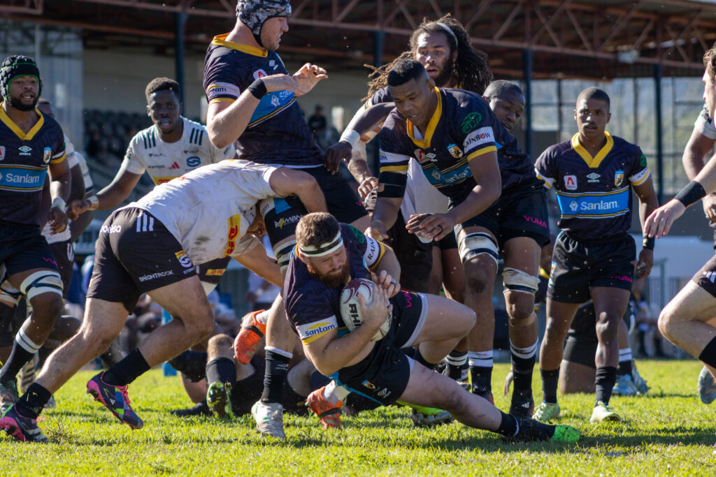 Photo: Llewellyn Classen (ball in hand) and Marlyn Williams of the Sanlam Boland Kavaliers against the DHL Stormers XXIII in a warm-up match ahead of the 2026 Carling Currie Cup competition. Wellington, Western Cape. 04 July 2026. Photo by Sideline Frames/Kurshé-Lee Brandt